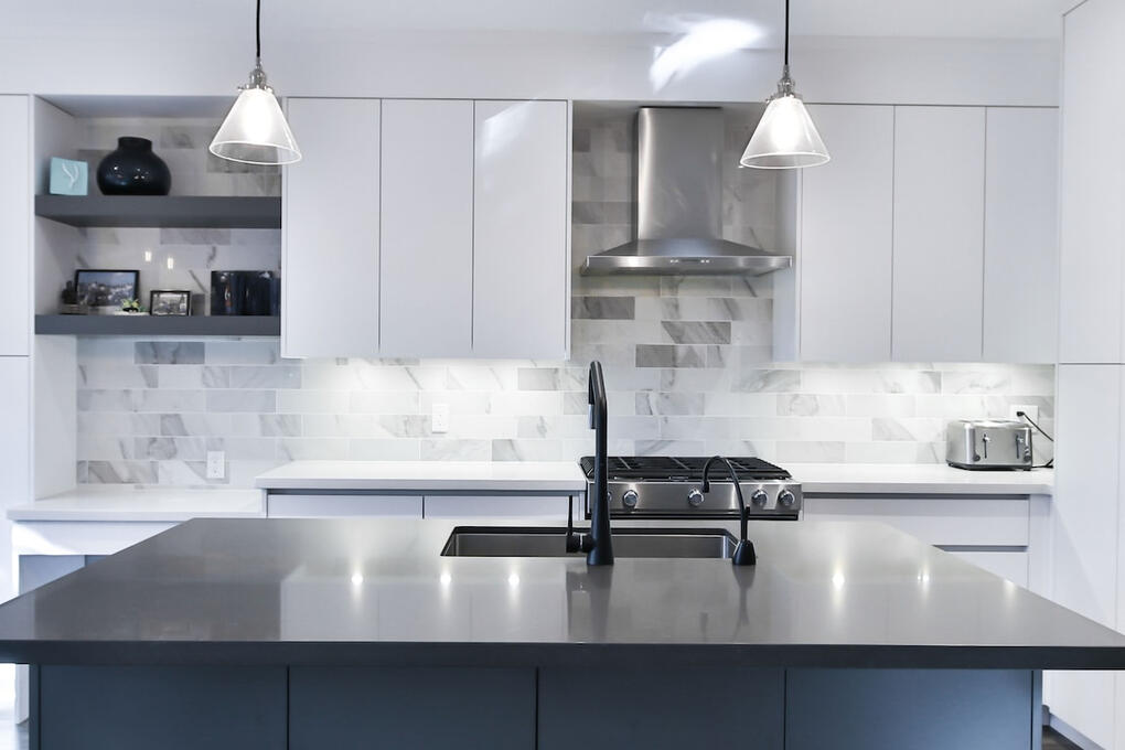 light kitchen with modern stainless steel appliance